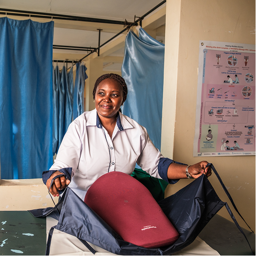 A medical professional leads training for the postpartum hemorrhage drape.