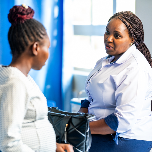A medical professional providing guidance to a mother. 