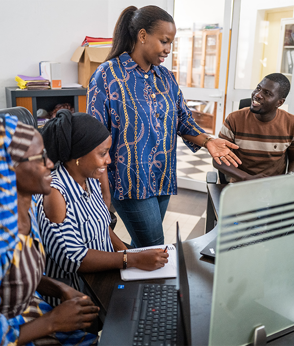 Dr. Billo Tall (center) shares information with colleagues at Institut Pasteur de Dakar, in Dakar, Senegal.