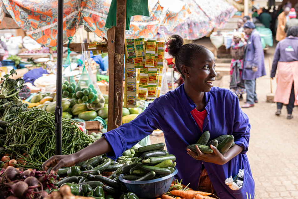 Margaret Nyambura arranges her stand at Karatina market in Karatina, Kenya.