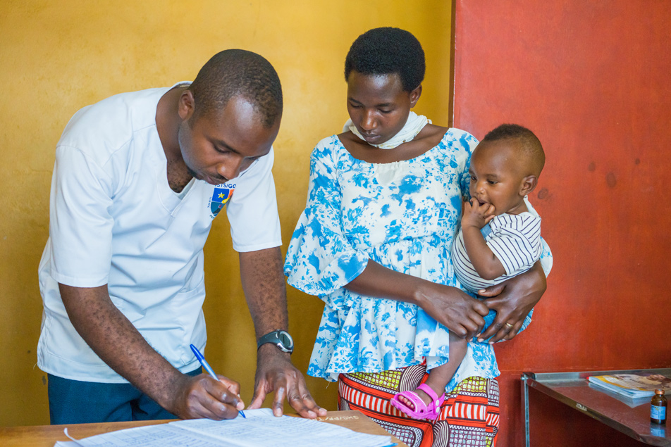 A nurse registers women for prenatal consultations at the health center in Gisenyi, Rwanda.