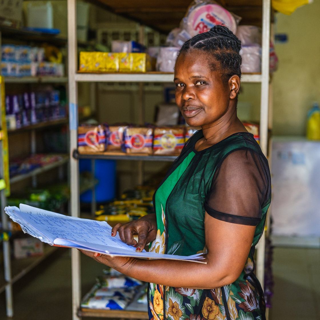 Coletta Kemboi selling her milk at a market in Eldoret City, Kenya.