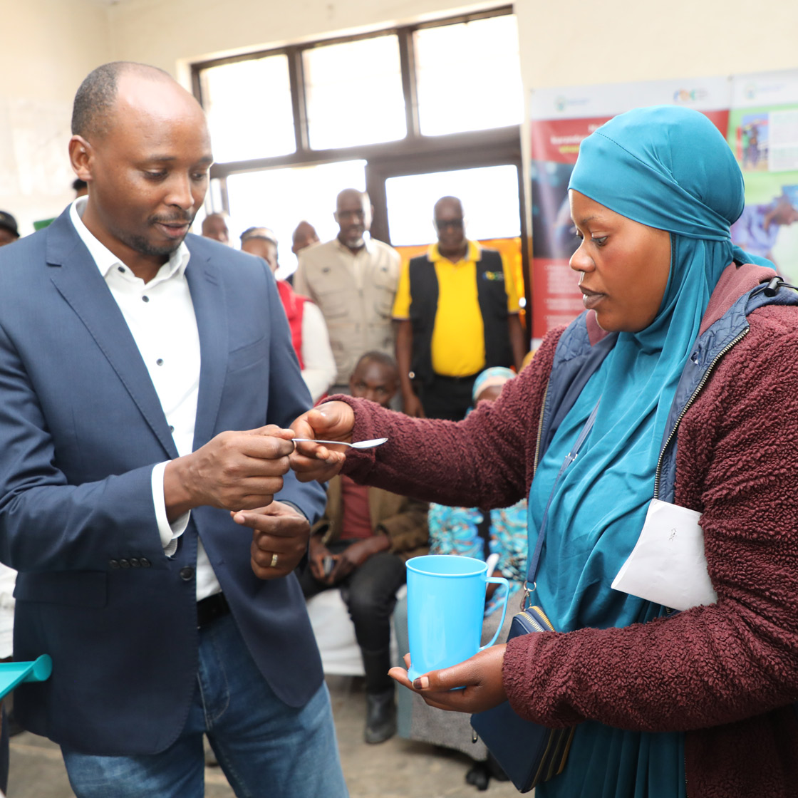 Dr. Nsanzimana Sabin, the Minister of Health, personally administers the inaugural doses of Multiple Micronutrient Supplementation to a pregnant woman, symbolizing the commencement of a transformative healthcare initiative.