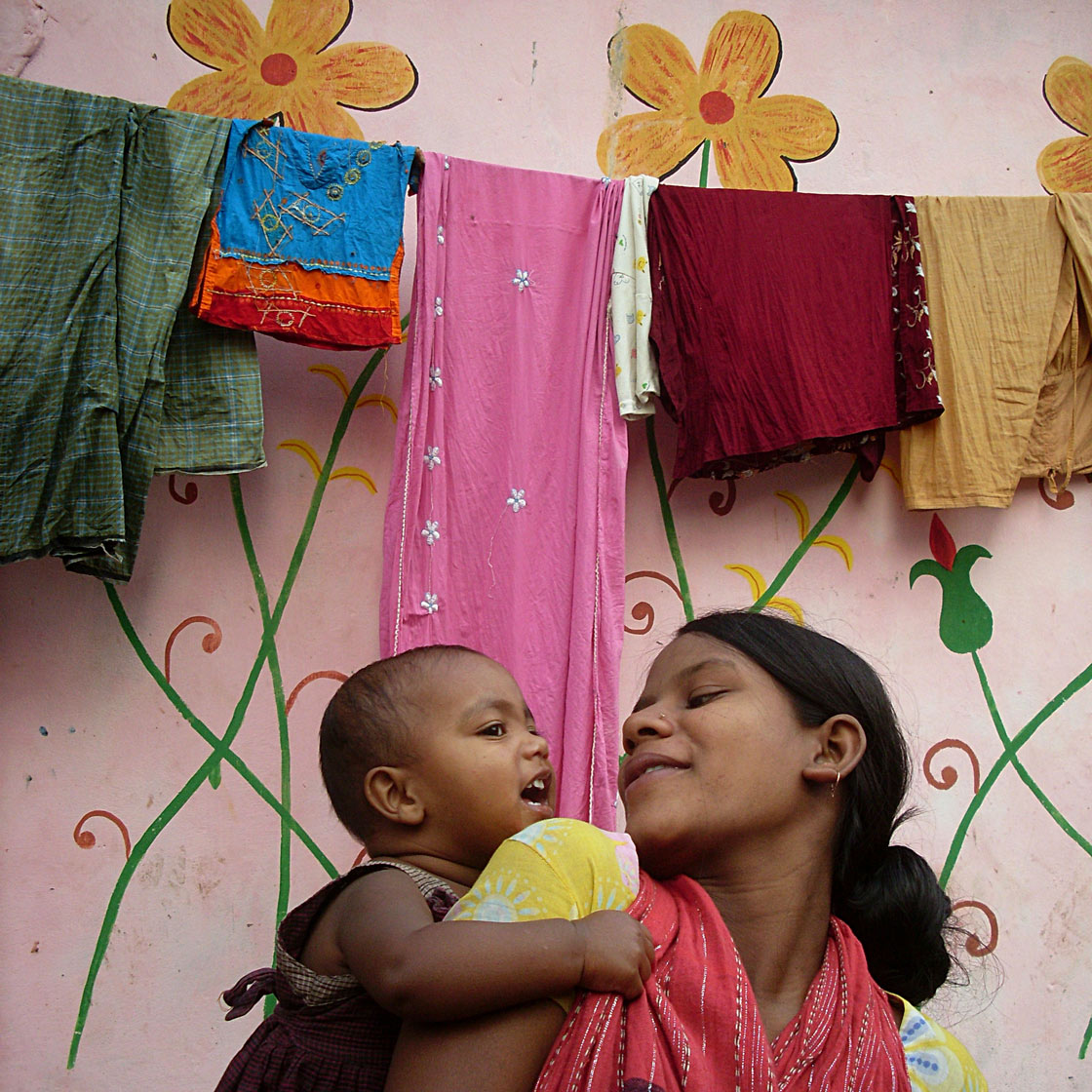 Lovely baby with her mother in Bangladesh.